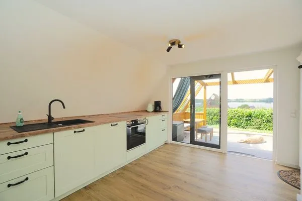 Küche / Küchenzeile  Modernes Nurdachhaus in ruhiger Feriensiedlung direkt am Wittensee mit Seeblick