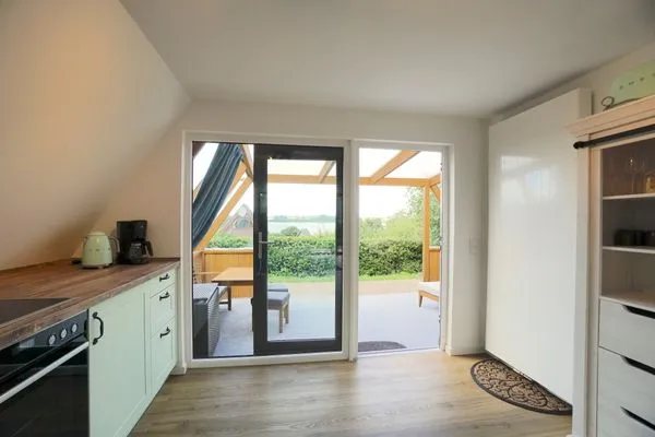 Küche / Küchenzeile  Modernes Nurdachhaus in ruhiger Feriensiedlung direkt am Wittensee mit Seeblick