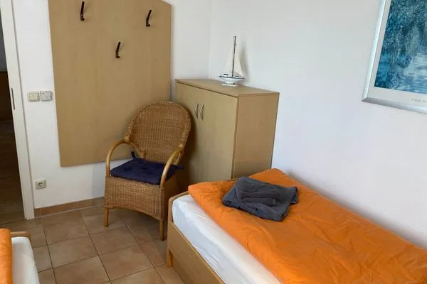 Schlafzimmer mit zwei Einzelbetten Residenz am Strand Wohnung 3-50