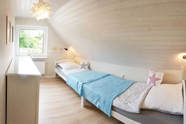 Schlafzimmer  Ferienwohnung Ankerplatz mit SPIELSCHEUNE am Wittensee