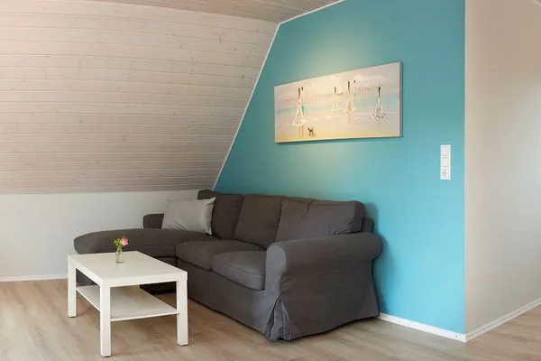 Wohnzimmer  Ferienwohnung Ankerplatz mit SPIELSCHEUNE am Wittensee