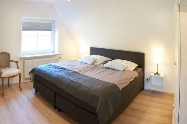 Schlafzimmer  Ferienwohnung Wasserspiel am Wittensee - mit SPIELSCHEUNE