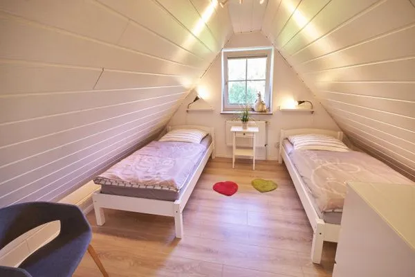 Schlafzimmer  Ferienwohnung Wasserspiel am Wittensee - mit SPIELSCHEUNE