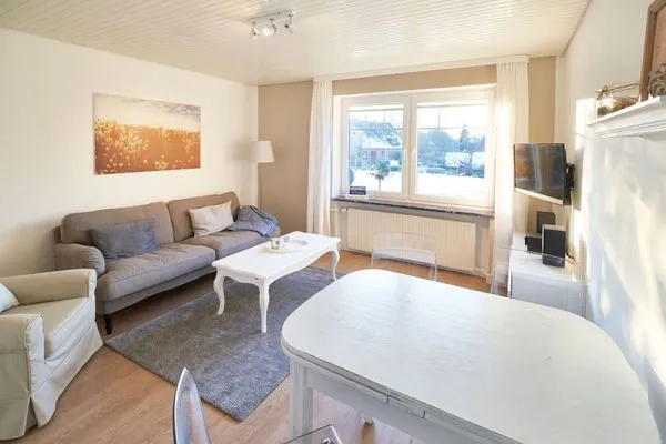 Wohnzimmer  Ferienwohnung Brise 5, mit SPIELSCHEUNE direkt am Wittensee