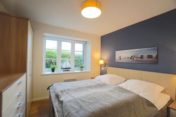 Schlafzimmer  Ferienwohnung Am Apfelbaum - romantische Remise direkt am Golfplatz und der Schlei