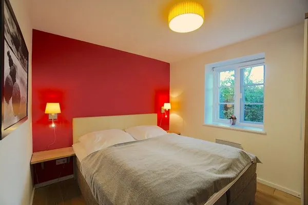 Schlafzimmer  Ferienwohnung Am Apfelbaum - romantische Remise direkt am Golfplatz und der Schlei