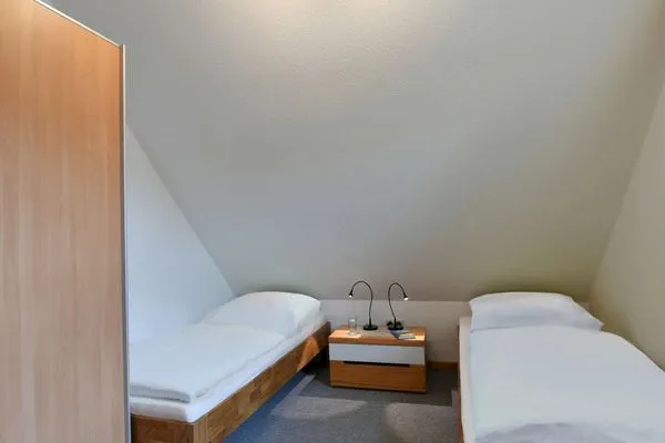 Schlafzimmer Kleine Pinkenburg Ferienwohnung Nord
