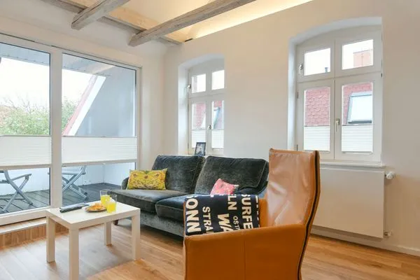 Wohnzimmer Logirhaus Doyen Ferienwohnung 9