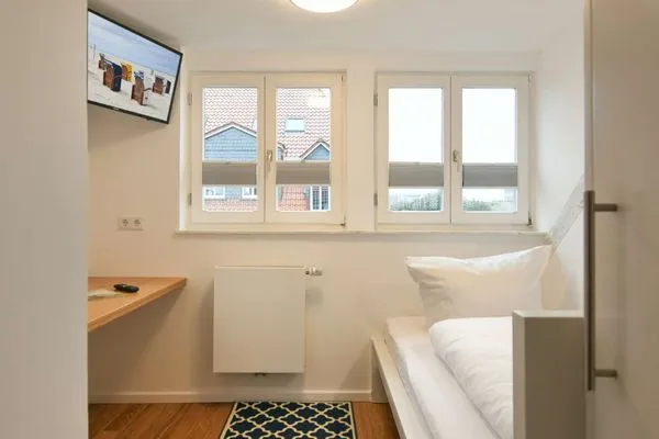 Schlafzimmer Logirhaus Doyen Ferienwohnung 9
