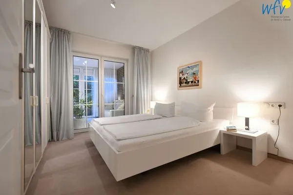 Schlafzimmer Juist Zauber - Haus 3 Ferienwohnung Lampe