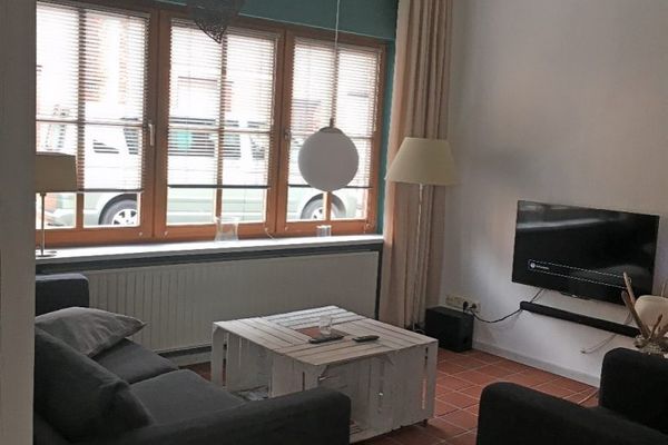  Lüttje Ferienhuus Tönning - Wohnzimmer