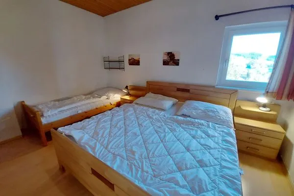 Schlafzimmer  Apartment Grimmingsuite by FiS - Fun in Styria