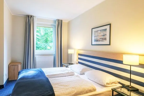 Ferienwohnung Seebär in Zingst Schlafzimmer mit gemütlichem Doppelbett  Seebär