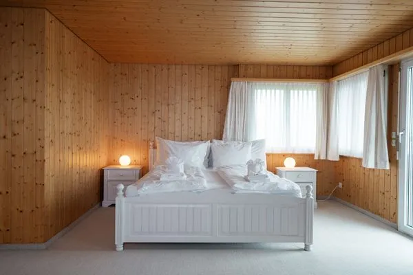 Bedroom with double bed  Ferienhaus Bergblick