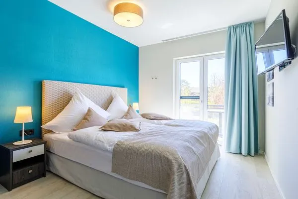 Ferienwohnung Swantovit Ostseebad Wustrow - ZweiWasser Alte Seefahrtschule Schlafzimmer  Swantovit