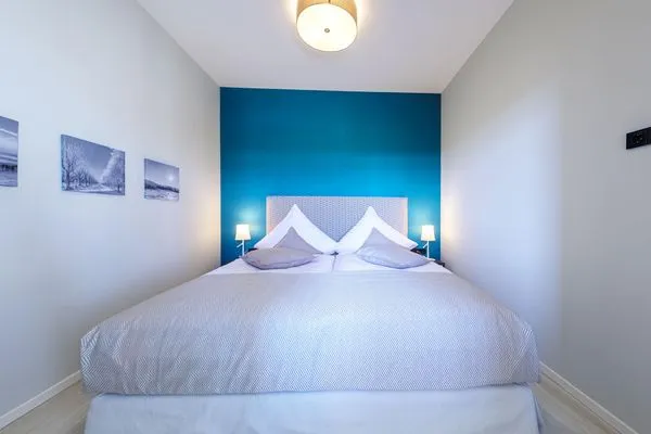 Ferienwohnung Große Welle Ostseebad Wustrow - ZweiWasser Alte Seefahrtschule Schlafzimmer  Große Welle