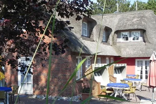 Terrasse Hüs Sanskiin Ferienwohnung *Driiwholt*