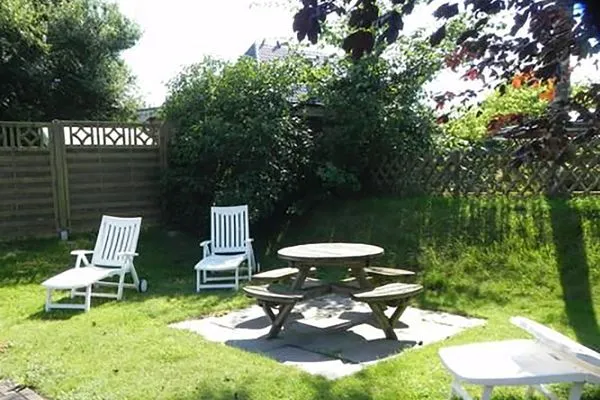 Terrasse Hüs Sanskiin Ferienwohnung *Driiwholt*