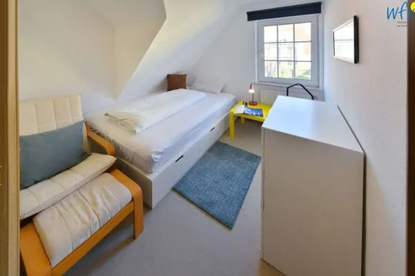 Schlafzimmer Familienhaus im Dorfgroden 27 Ferienwohnung kleiner Kompass