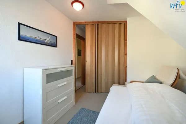 Schlafzimmer Familienhaus im Dorfgroden 27 Ferienwohnung kleiner Kompass