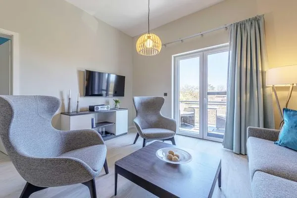 Ferienwohnung Columbus Suite Ostseebad Wustrow ZweiWasser Alte Seefahrtschule Wohnzimmer  Columbus Suite