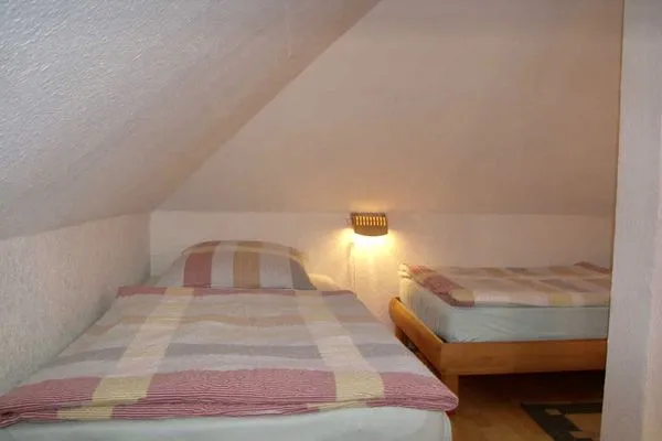 Schlafzimmer  Villa Exxs, Whg. 7 "Harmonie"