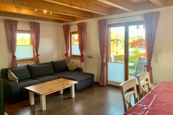 Feriendorf Via Claudia Ferienhaus Lechsee Ferienwohnungen in Lechbruck - Wohnzimmer