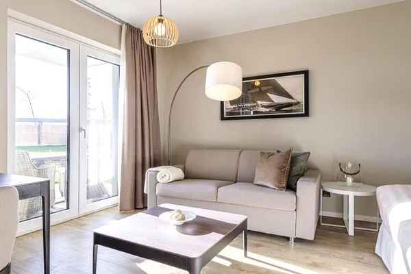 Ferienwohnung Kleiner Strandkorb Ostseebad Wustrow ZweiWasser Alte Seefahrtschule Gemütlicher Wohnbereich  Kleiner Strandkorb