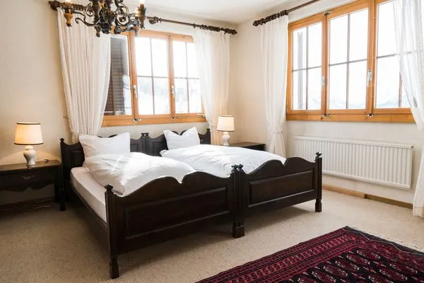 Bedroom with double bed  Chalet Theresia