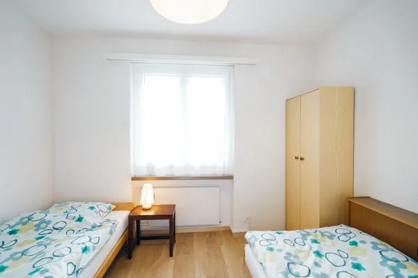 Bedroom with two single beds  Apartment Im Aeschen