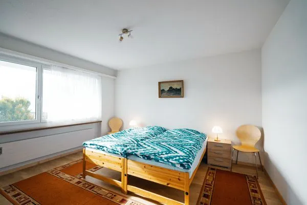 Bedroom with double bed  Apartment Im Aeschen