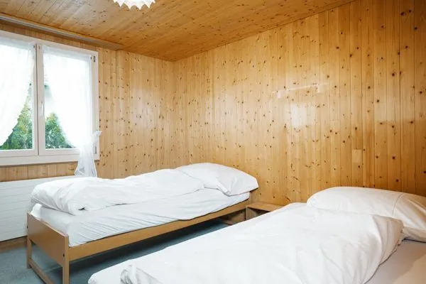 Bedroom with two single beds  Chalet Biodola