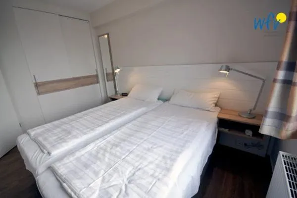 Schlafzimmer Haus Dünenblick Ferienwohnung 11