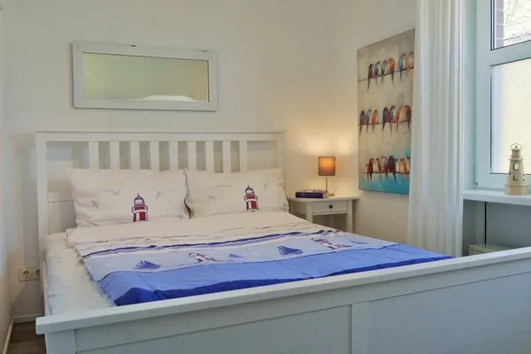Schlafzimmer mit Doppelbett  Kapitänsgarten Wohnung 25