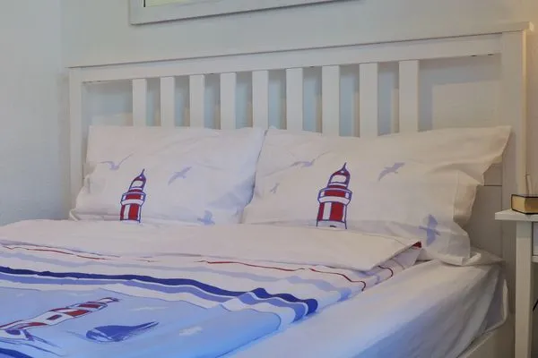 Schlafzimmer mit Doppelbett  Kapitänsgarten Wohnung 25