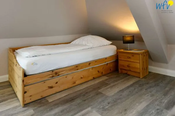 Schlafzimmer Haus Dünenrose Ferienwohnung Strandläufer