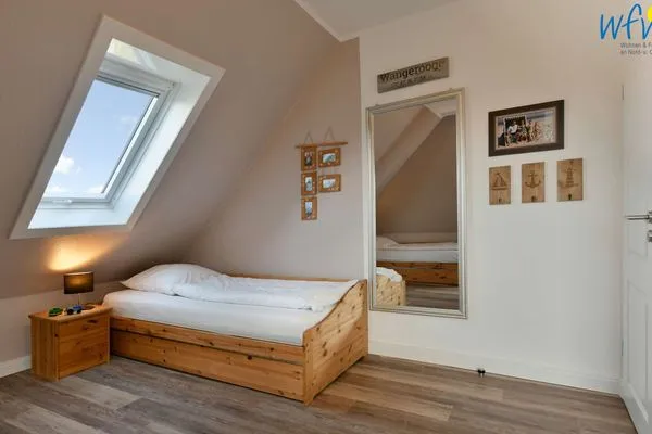 Schlafzimmer Haus Dünenrose Ferienwohnung Strandläufer