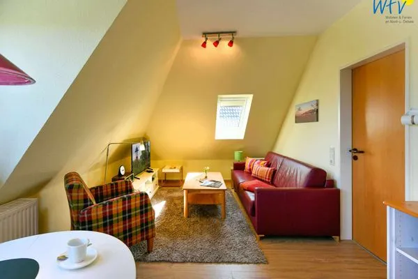 Wohnzimmer Haus Dünenrose Ferienwohnung Inselnest