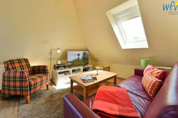 Wohnzimmer Haus Dünenrose Ferienwohnung Inselnest