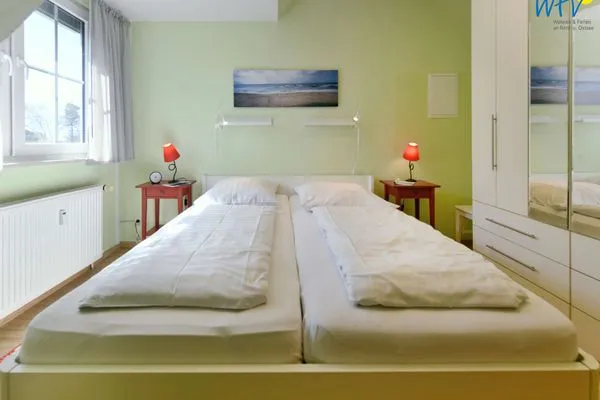Schlafzimmer Haus Dünenrose Ferienwohnung Inselnest
