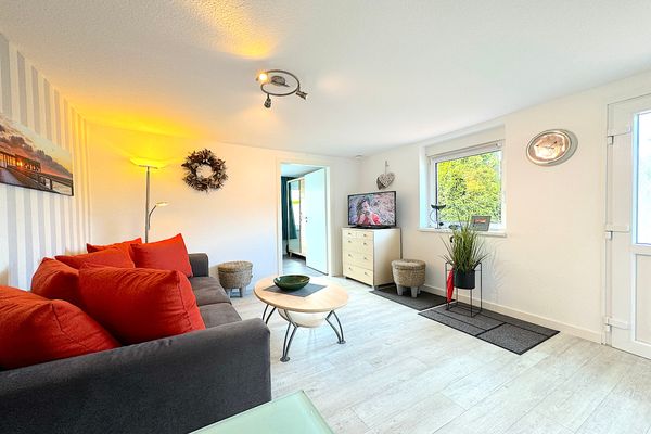  Haus Svane Gartenhaus Kellenhusen - Wohnzimmer