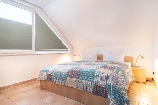 Schlafzimmer mit Doppelbett Residenz am Strand Wohnung 5-73