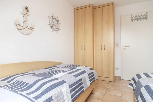 Schlafzimmer mit zwei Einzelbetten Residenz am Strand Wohnung 5-73