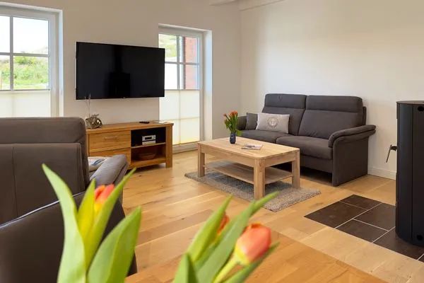 Wohnzimmer Haus Dünenperle Ferienwohnung "Dünengras"