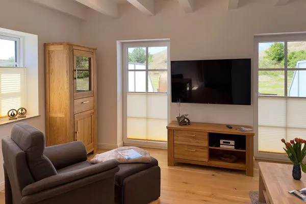 Wohnzimmer Haus Dünenperle Ferienwohnung "Dünengras"