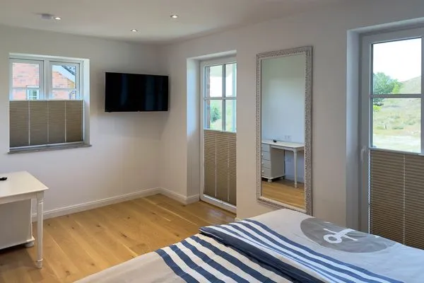 Schlafzimmer Haus Dünenperle Ferienwohnung "Dünengras"