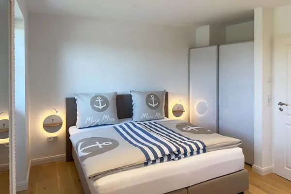 Schlafzimmer Haus Dünenperle Ferienwohnung "Dünengras"