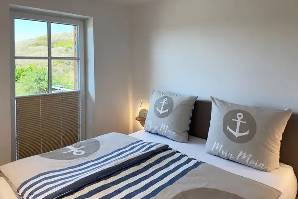 Schlafzimmer Haus Dünenperle Ferienwohnung "Dünengras"