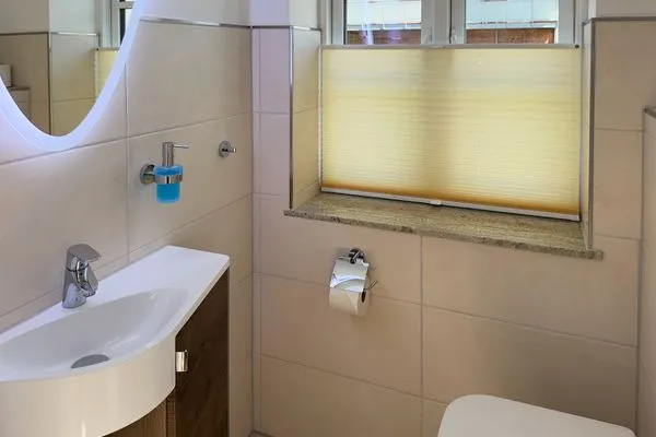 Gäste-WC Haus Dünenperle Ferienwohnung "Dünengras"