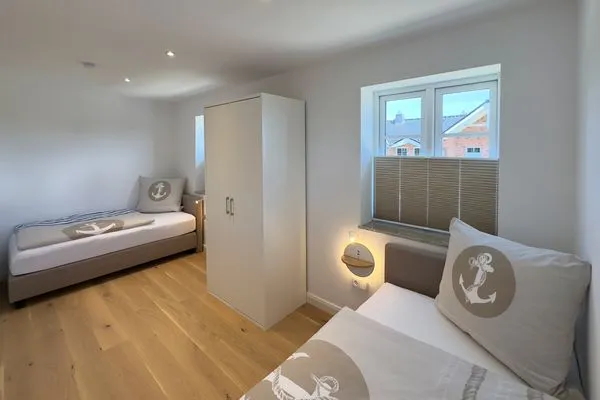 Schlafzimmer Haus Dünenperle Ferienwohnung "Dünengras"